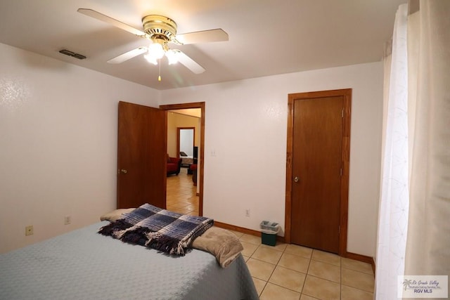 bedroom featuring ceiling fan and light tile patterned floors