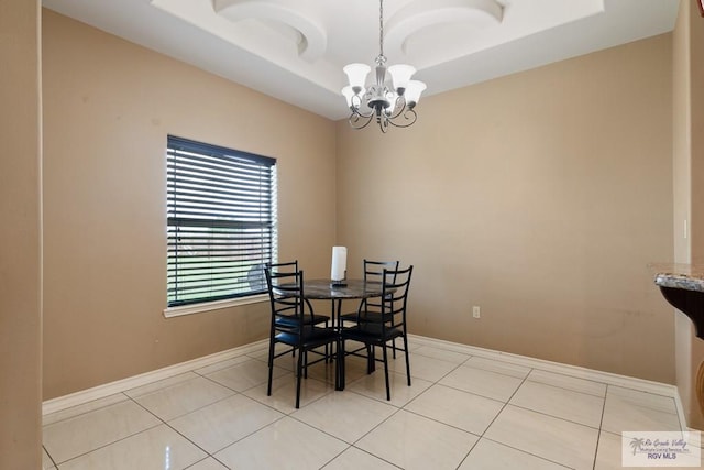 tiled dining area with an inviting chandelier