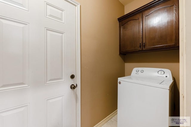 laundry area with washer / clothes dryer and cabinets