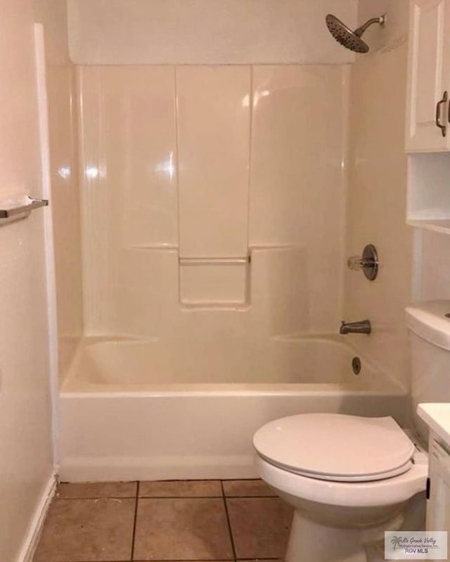 full bathroom with washtub / shower combination, tile patterned flooring, vanity, and toilet