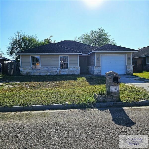 single story home with a garage