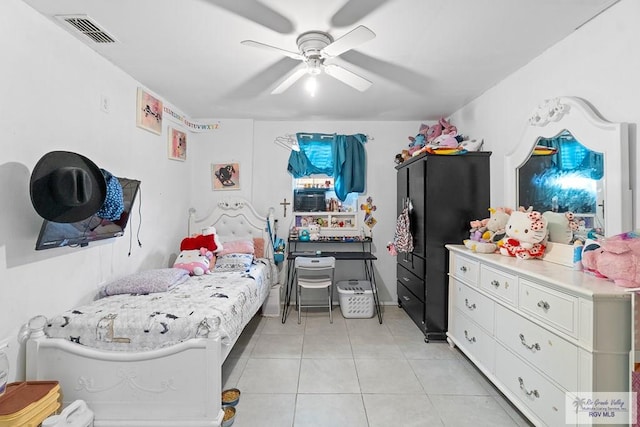 bedroom featuring light tile patterned flooring, a ceiling fan, and visible vents