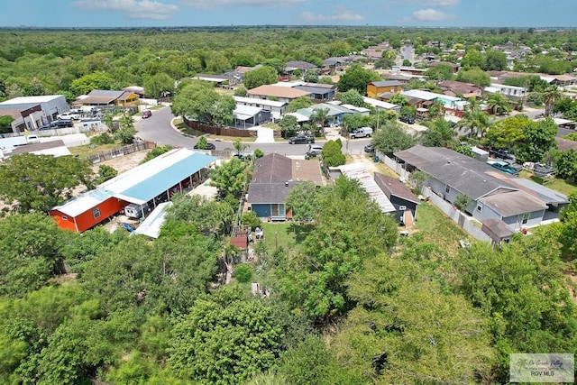 drone / aerial view with a view of trees and a residential view