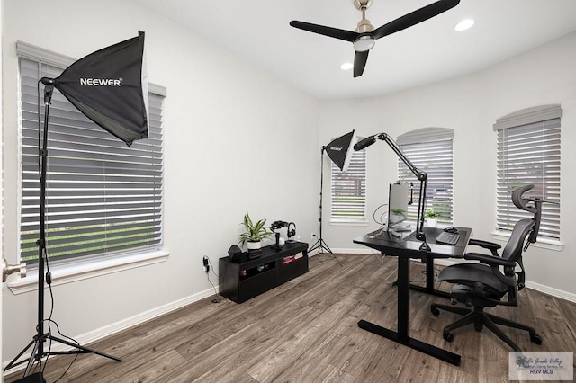 office space with hardwood / wood-style flooring, ceiling fan, and a healthy amount of sunlight