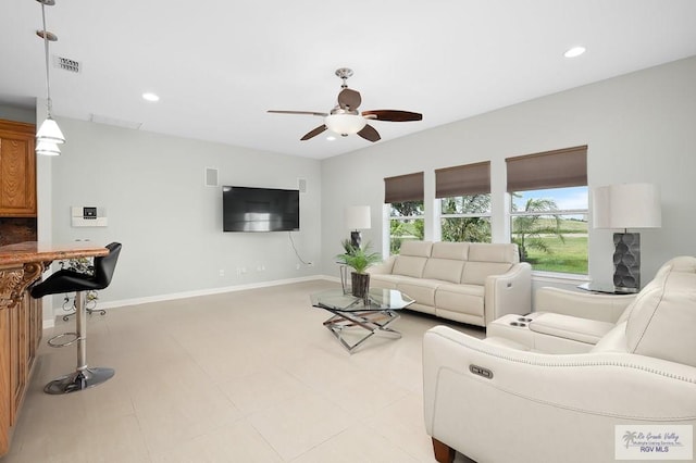 living room with ceiling fan