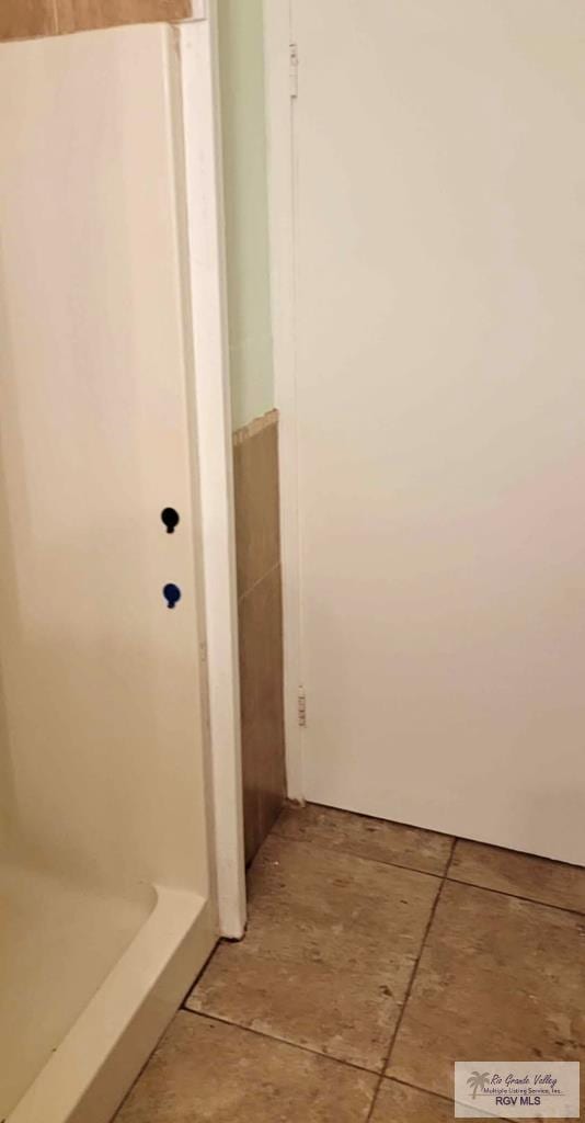 bathroom featuring tile patterned flooring