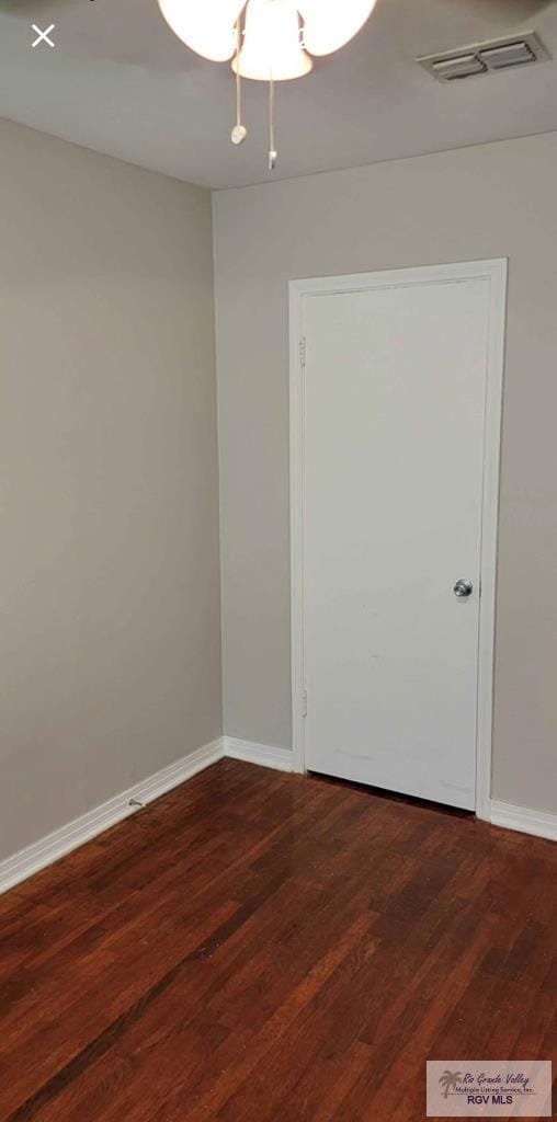 spare room featuring dark hardwood / wood-style flooring