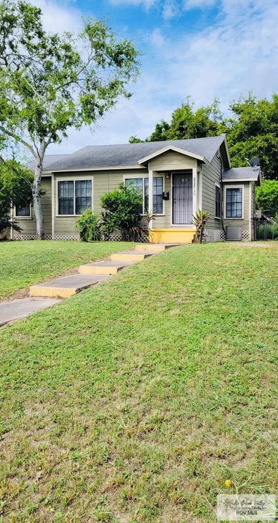 ranch-style house with a front yard