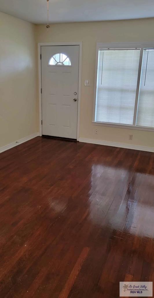 entryway with dark hardwood / wood-style floors