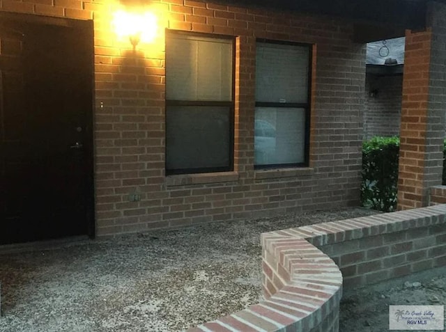 6212 NW King Arthur Ct, Harlingen, TX 78550 - view of side of property featuring brick siding