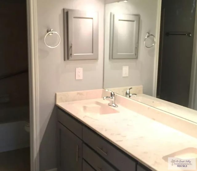 6212 NW King Arthur Ct, Harlingen, TX 78550 - full bath featuring double vanity and toilet