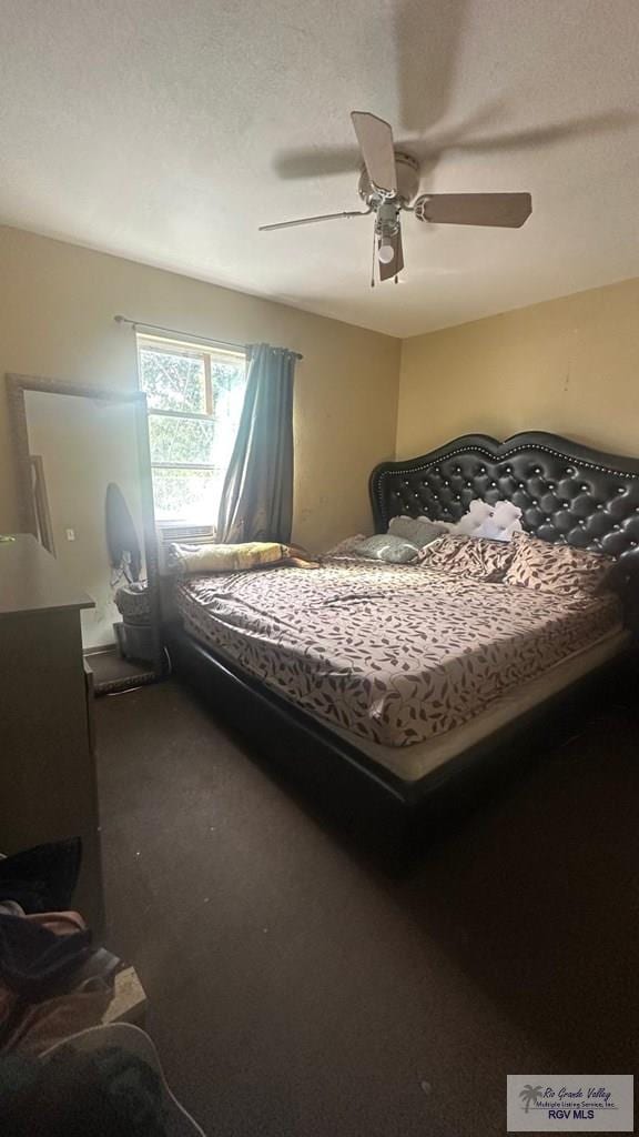 carpeted bedroom with a ceiling fan