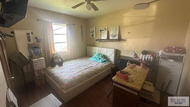 bedroom with ceiling fan and wood finished floors