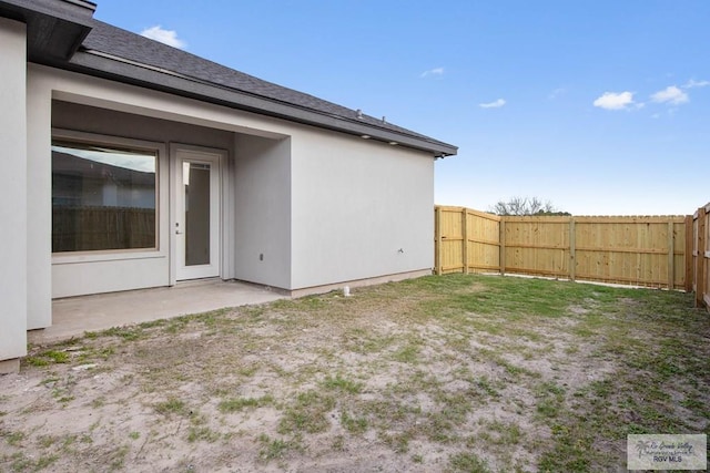 view of yard featuring a patio and a fenced backyard