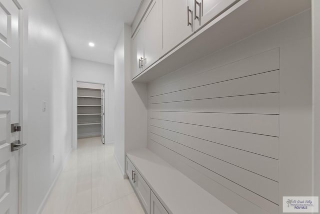 mudroom featuring recessed lighting and light tile patterned floors