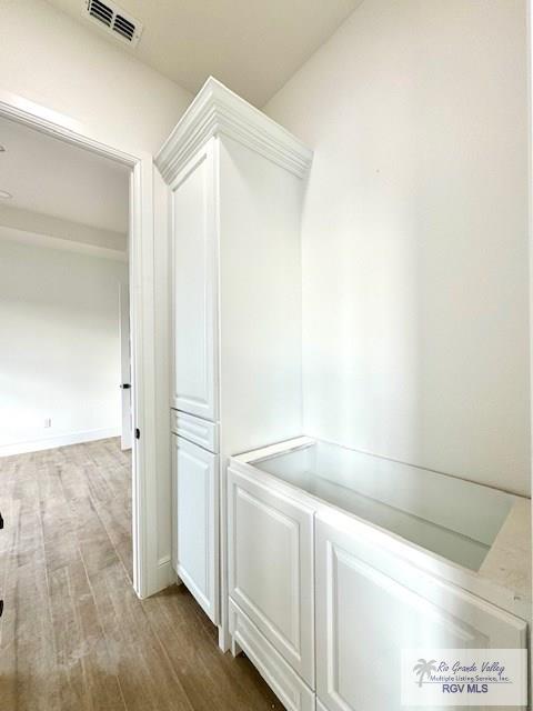 mudroom featuring wood-type flooring