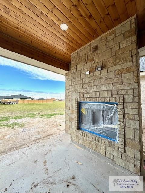 details featuring an outdoor stone fireplace