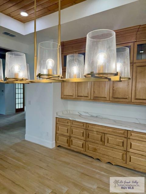 kitchen featuring wood ceiling and light wood-type flooring