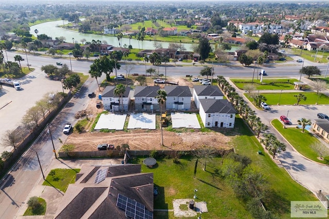 aerial view featuring a residential view and a water view