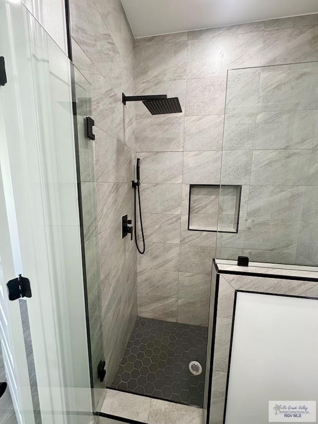 bathroom featuring an enclosed shower