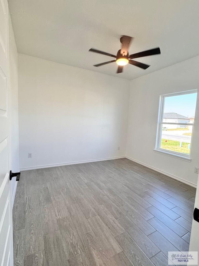 unfurnished room featuring light hardwood / wood-style flooring and ceiling fan