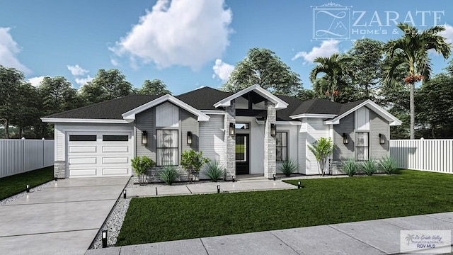 view of front of home with a garage and a front yard