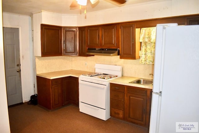 kitchen with white appliances, ceiling fan, and sink