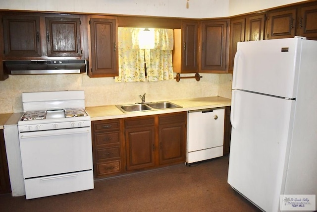 kitchen featuring sink, white appliances, and exhaust hood