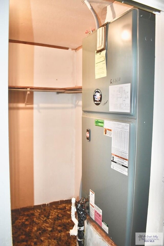 utility room with heating unit