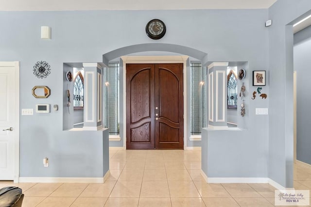 entrance foyer featuring light tile patterned floors