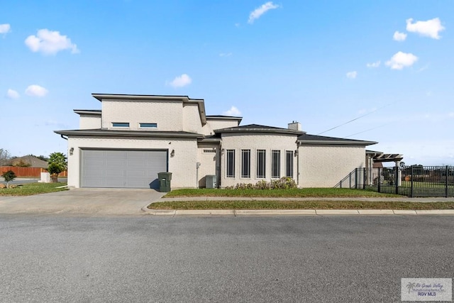 prairie-style house with a garage and cooling unit