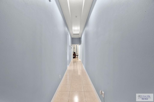 hallway featuring light tile patterned floors