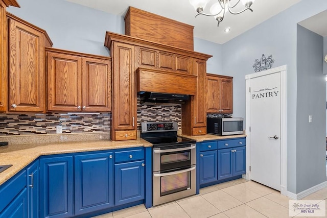 kitchen featuring appliances with stainless steel finishes, tasteful backsplash, ventilation hood, a chandelier, and light tile patterned floors