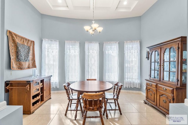 dining room featuring coffered ceiling, light tile patterned floors, a notable chandelier, and beam ceiling