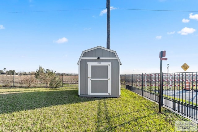 view of outdoor structure featuring a lawn