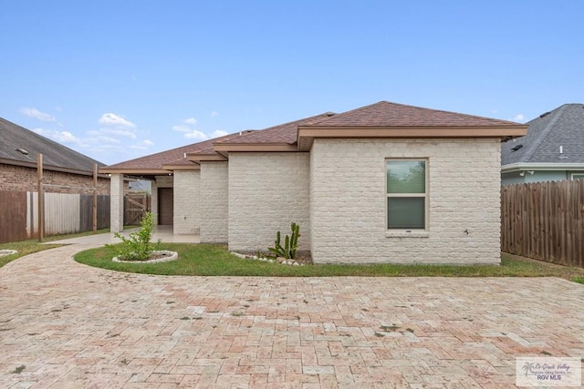 rear view of house featuring a patio area