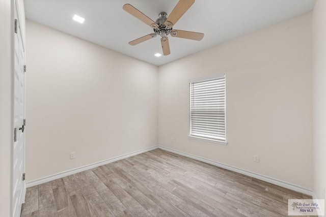 unfurnished room featuring ceiling fan and light hardwood / wood-style flooring