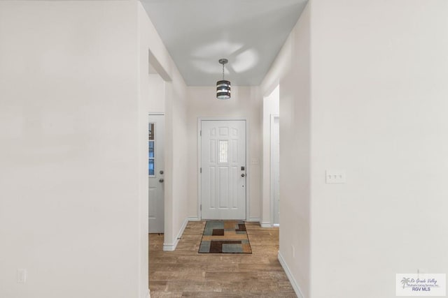 doorway to outside featuring hardwood / wood-style flooring