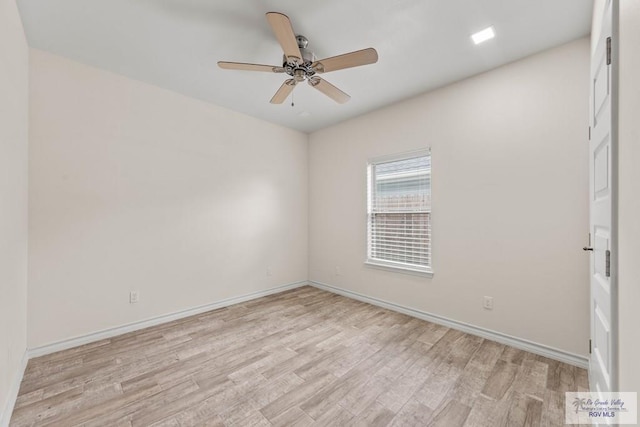 empty room with light hardwood / wood-style floors and ceiling fan