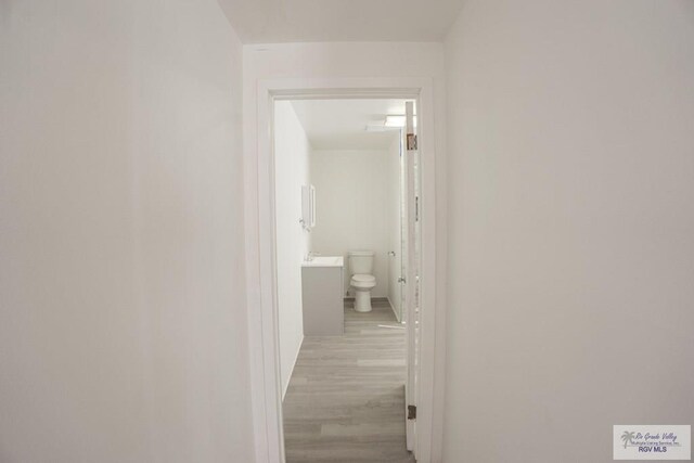 hallway featuring light hardwood / wood-style flooring