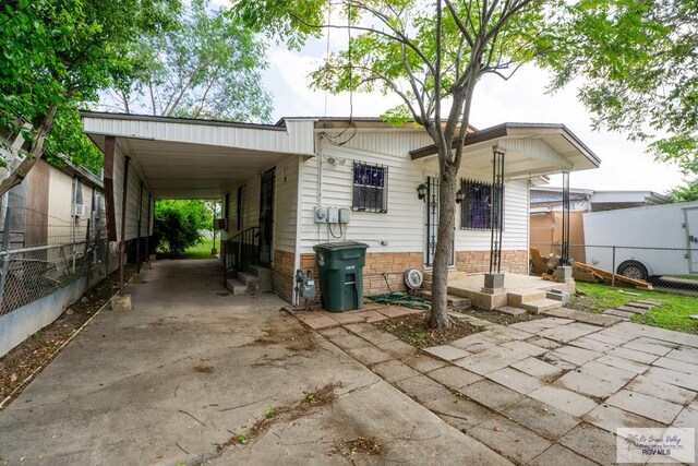 exterior space with a carport