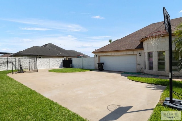 view of home's exterior with a yard and a garage