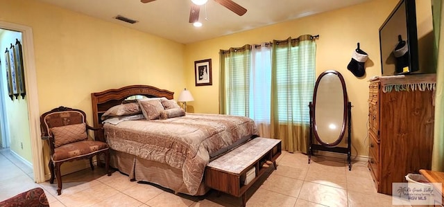 bedroom featuring light tile patterned floors, visible vents, and a ceiling fan