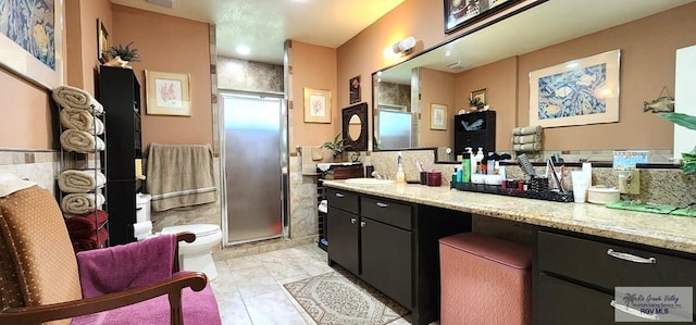full bath featuring vanity and a shower stall