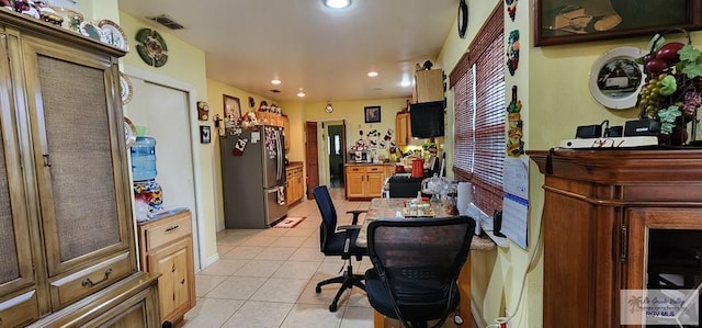office space featuring light tile patterned flooring, visible vents, and recessed lighting