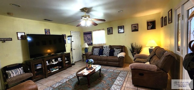 tiled living area with visible vents and a ceiling fan