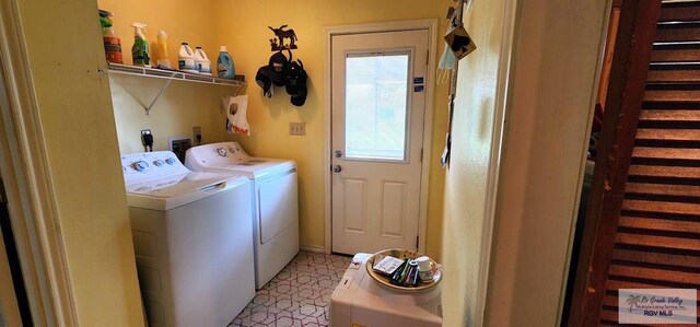 washroom with washer and clothes dryer and laundry area