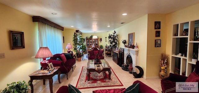 living room with light tile patterned floors and recessed lighting
