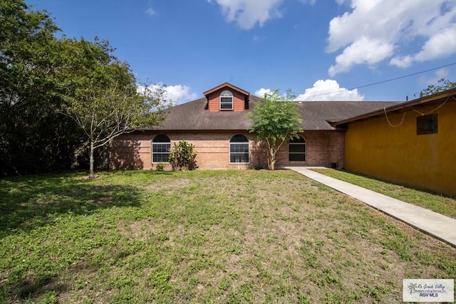 123 Maine St, Santa Rosa, TX 78593 - ranch-style house with brick siding and a front yard