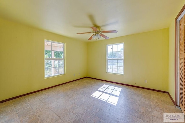 22916 N Oscar St, Harlingen, TX 78552 - empty room with plenty of natural light and ceiling fan